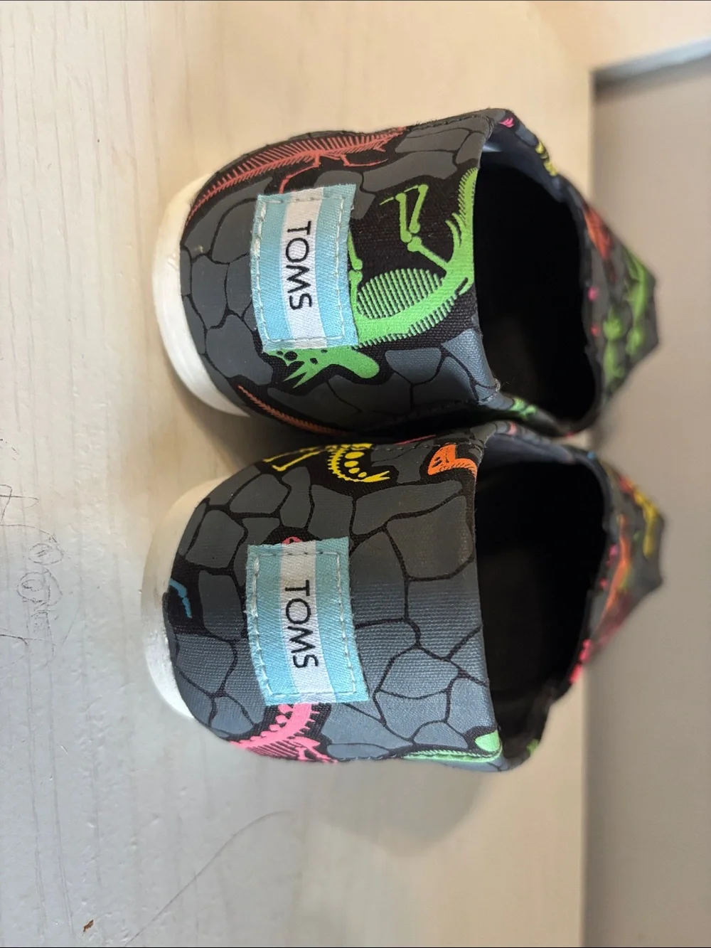TOMS Slip-On Sneakers - Gray with Neon Dinosaur Prints